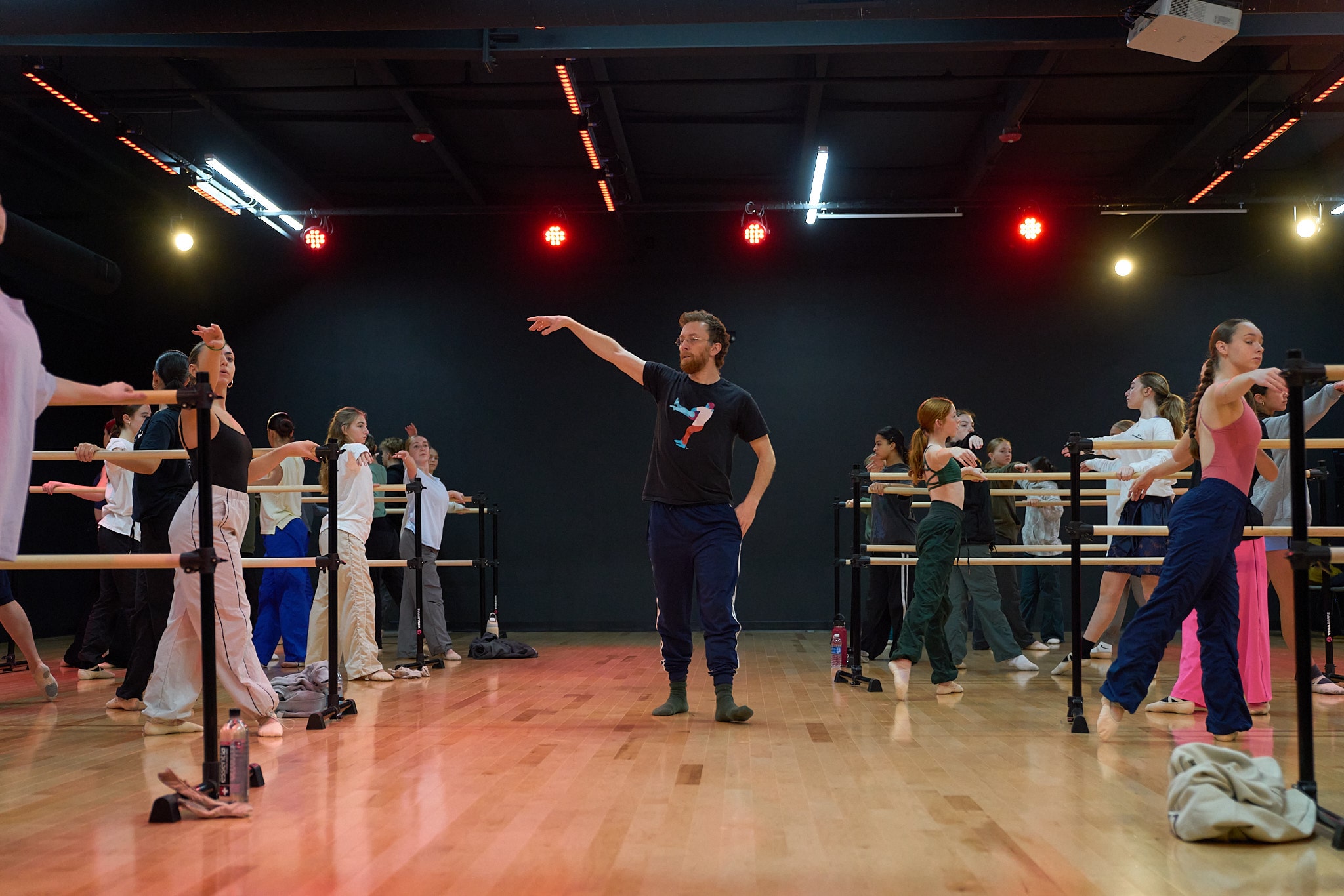 Dance teacher instructing students